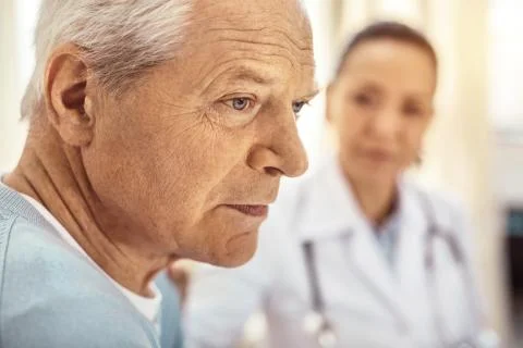 Sad cheerless man thinking about his life Foto stock