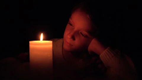 Sad Child by Candles, Prayer Kid in Nigh... | Stock Video | Pond5