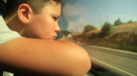 Sad child looking out window 2 Stock Footage 64731813
