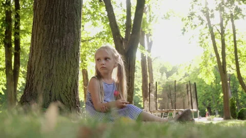 Sad child in the park Stock Footage 137635850