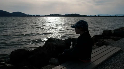 Sad child on the seashore. Stock Footage 233121044