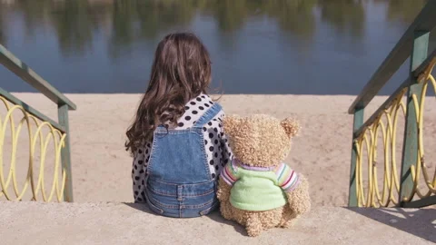 Sad child with a toy. Stock Footage