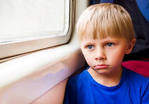 Sad Child in the Train Stock Photos