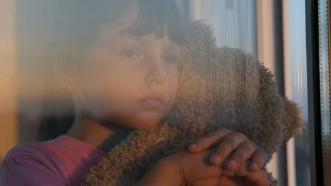 Sad child by the window. Stock Footage 118498485