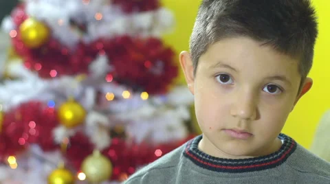 Sad child for a wrong present in christmas time, frustrastion Stock Footage 59934469
