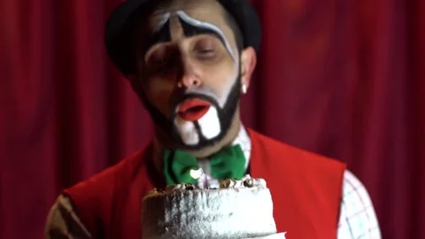 A sad clown with a candle Stock Footage 85017705