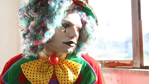 A sad clown is looking around Stock Footage 117720077