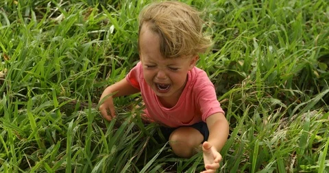 Sad crying toddler pulls his hands up Stock-Footage 100133321