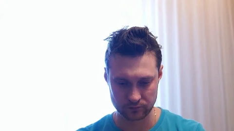 Sad, depressed man drinking tea Stock Footage 87015794