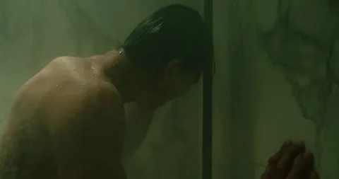 Sad depressed man grieving, screaming in shower under stream of hot water. Stock Footage 338010772
