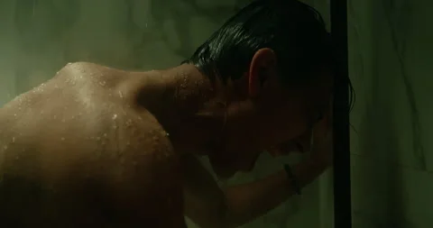Sad depressed man grieving, screaming in shower under stream of hot water. Stock Footage 338010819