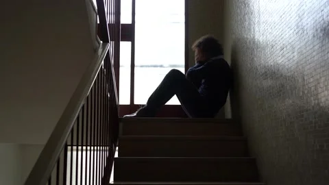 Sad depressed man sitting down  thinks about suicide due to money problems, fami Stock Footage 233613867
