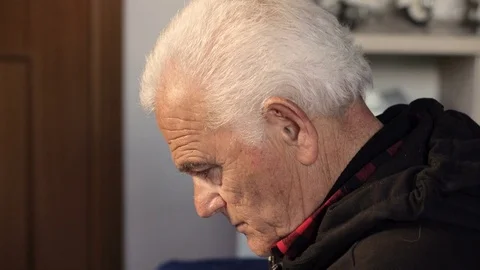 Sad depressed old man's profile at home- close up Stock-Footage 74701259