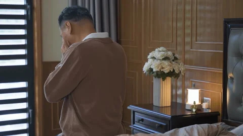 Sad depressed senior man crying covering face with hands, regret for past Stockbeeldmateriaal 332627642