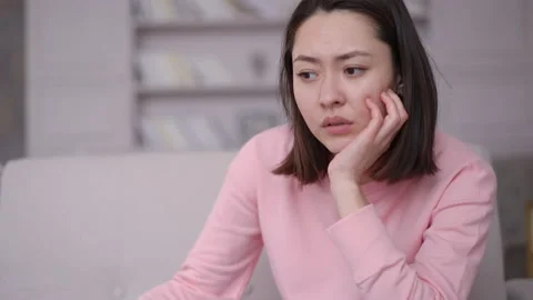 Sad depressed young multi ethnic woman feeling bad stressed worried anxious Stock Footage 151267994