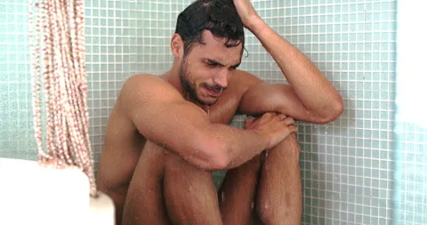 Sad, depression and a crying man in the shower with stress, anxiety or mental Stock Footage 253699412