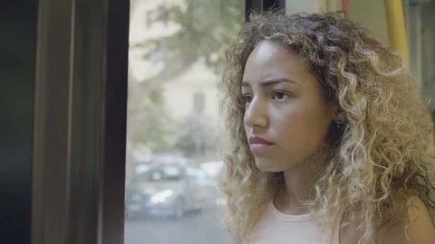 Sad desperate woman on the bus: she's deep in her problems and pains Stock Footage