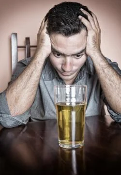 Sad drunk hispanic man Stock Photos