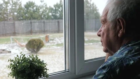 Sad Elderly Old Man Looks Thoughtfully Out Of Window From The House Stock Footage 178986397