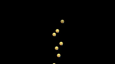 Sad emoji tears falling in vertical motion on black backdrop Stock Footage 346490699