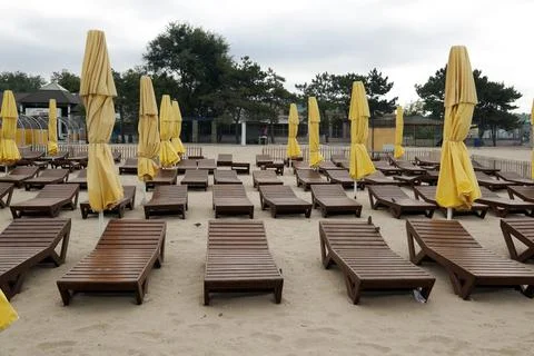 Sad empty winter beach in low season in Black sea, Russia, landscape with empty Stock Photos