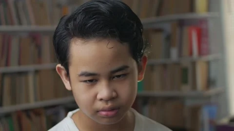 Sad expression of an Asian boy Stock Footage 142768098