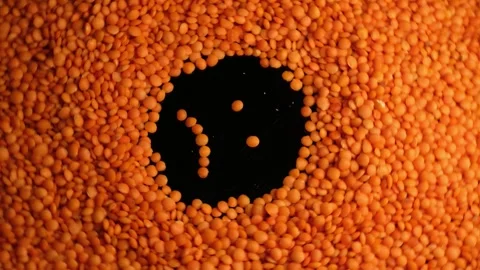 Sad Face Emoji Made from Red Lentils Close Up Stock Footage 329967441
