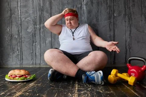 Sad fat man is in a difficult position Foto stock