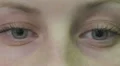 sad female blu eyes - move - open - close - macro HD Footage