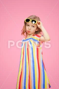 Sad girl pouting lips on pink Stock Photos
