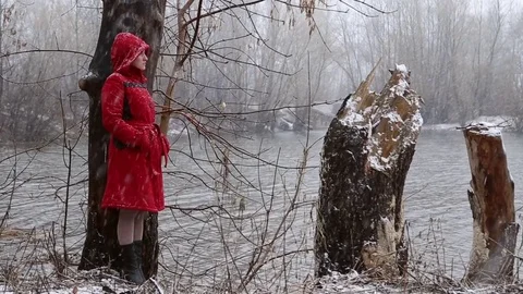 Sad girl standing by the river Stock Footage 74780503
