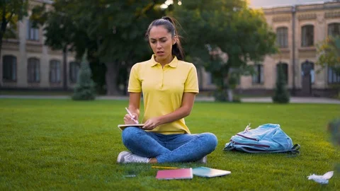 Sad girl student solves a complex project and all entries are incorrect. 4K Stock Footage 127748773