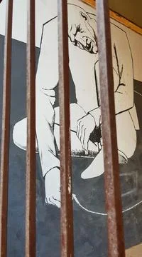 Sad Grieving Man Behind the Bars Graffiti Stock Photos