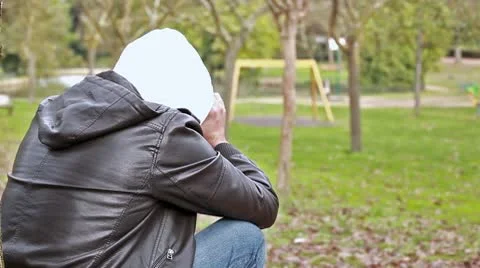 Sad guy at park Stock Footage 10580174