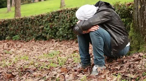 Sad guy at park Stock Footage 10580210