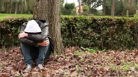 Sad guy at park Stock Footage 10580282