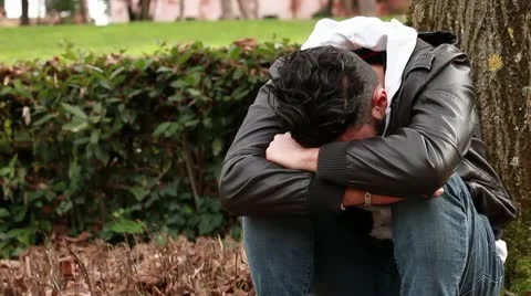 Sad guy at park Stock Footage 10580648