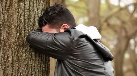 Sad guy at park Stock Footage 10582040