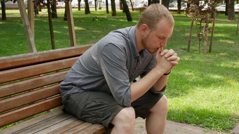 The sad guy removes the ring from his finger and squeezes in his hand. Stock Footage 113292435