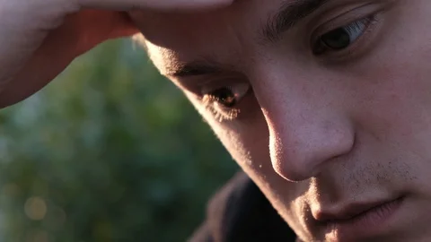 Sad guy scratching his forehead and doesn’t know what to do Stock Footage 106958312