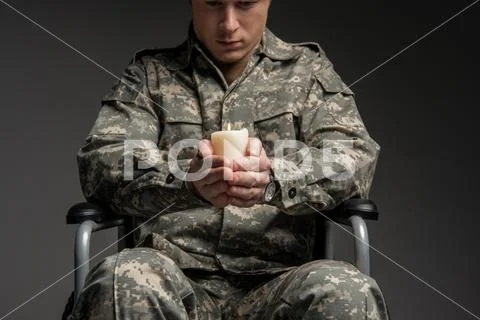 Sad handicapped male veteran praying Stock Photos