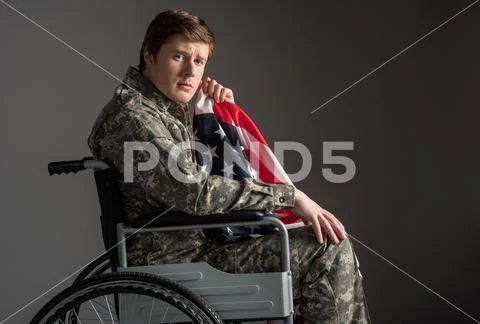 Sad handicapped veteran suffering from sorrow Stock Photos
