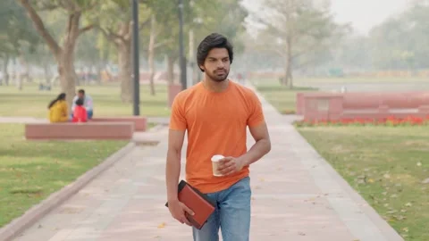 Sad Indian Student Walking With Coffee in Hand Stock Footage 300107421
