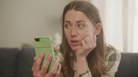 Sad Lady Talking Smartphone at Home 스톡 동영상 278683038