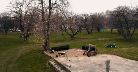 Sad landscape with empty chairs and swing set in a park in autumn Stock Footage 153184735