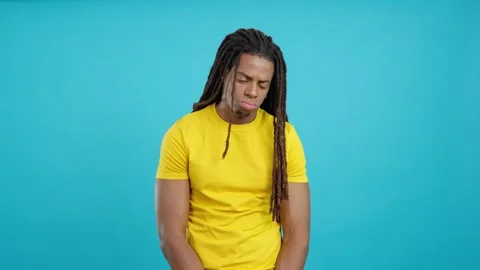 Sad latin man with dreadlocks looking at camera Stock Footage 240581631