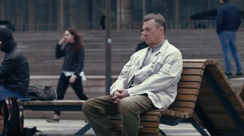 A sad, lonely man sitting on the bench Stock Footage 62776290