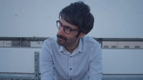 Sad male on rooftop thinking missing someone frustrated, disappointed Stock Footage 293588239