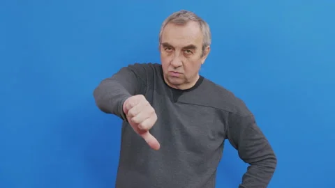 Sad man in basic casual blue t-shirt isolated on blue background studio. People Stock Footage 144662627