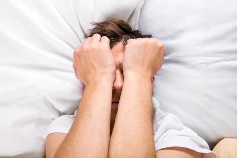Sad Man in the Bed Foto stock